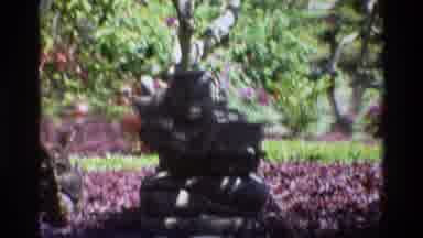 Singapore (1984): Flowers Bloom Stone Garden Two People Tower Sky Trees Wall