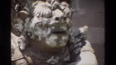 Singapore (1984): Sculpted Statue In Front Of Carvings On Stone Wall Then Camera