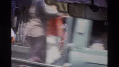 Singapore (1984): People Are Working And A Man In A Car Is Moving