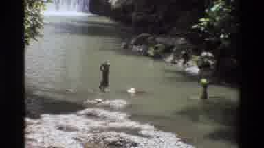 Singapore (1984): People Carrying Basket On Their Heads And Washing Clothes In A