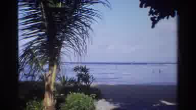 Singapore (1984): Scenic Beach Which Has Just Only Two People In The Water