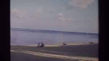 Singapore (1984): People Relaxing On A Beach In The Sun
