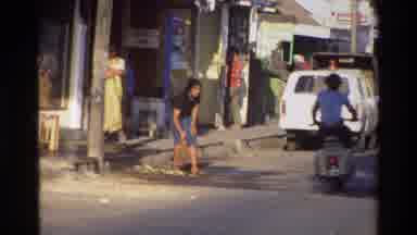 Singapore (1984): Two People On A Moving Motorcycle In A Densely Populated City
