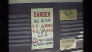 Singapore (1984): Man Walking In Street Crosses The Transformer Room Danger High