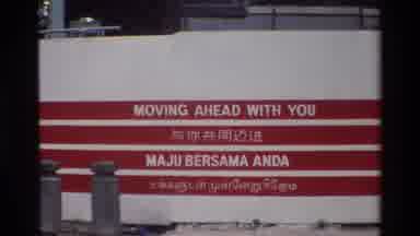 Singapore (1984): Foreign City With A Sign That Says Moving Ahead With You
