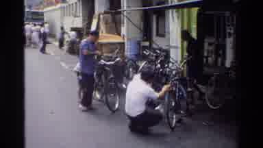 Singapore (1984): People Sightseeing Bicycles