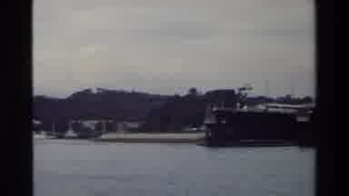 Singapore (1984): Freighter Boats Offloading At A Dock With Large Cargo