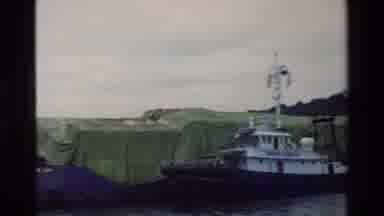 Singapore (1984): Cruise Ship Being Saved By A Mini Tugboat