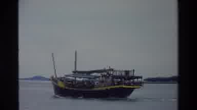 Singapore (1984): Boat Full Of People Sails To Destination On A Calm Sea