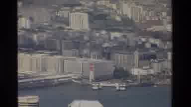Hong Kong (1984): A Port City Skyline On A Sunny Afternoon With Boats