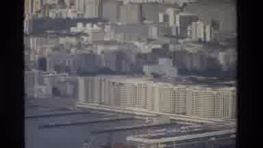 Hong Kong (1984): Different Aerial Views Of The City Below And The River And Boats