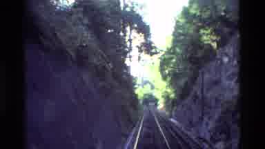 Hong Kong (1984): Train Is Moving In A Track And Building Is Shown