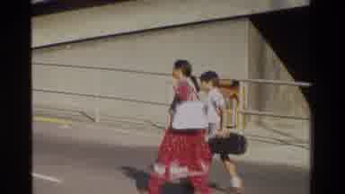 Hong Kong (1984): Mother And Son Walking On A Street And A Bus Captured In The