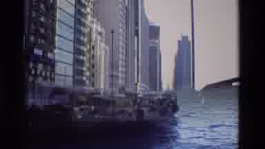 Hong Kong (1984): Boats On The Water Next To A City That Is Bustling In The Day