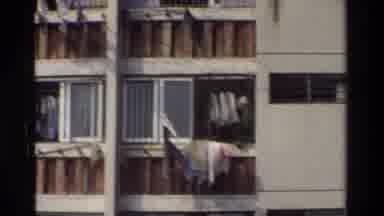 Hong Kong (1984): A Close Line Full Of Clothes Hanging Out Of An Apartment Window