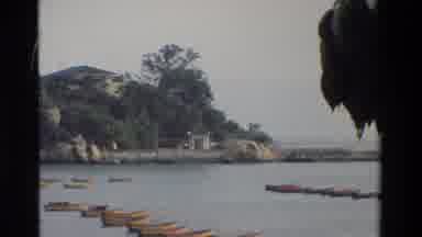 Hong Kong (1984): Asian Building Panning Shot That Transitions To Boats On Water