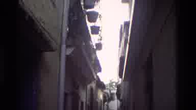 Hong Kong (1984): An Empty Lane Between Two Buildings Then Cuts Away To A Crowd Of