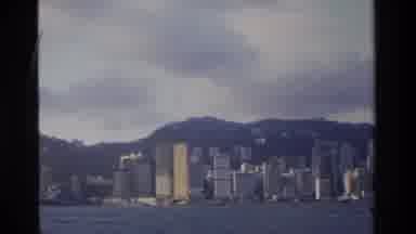 Hong Kong (1984): A Large City With Buildings Along Side Of A Body Of Water