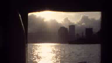 Hong Kong (1984): A View Of The Ocean Along With Skyscraper Buildings