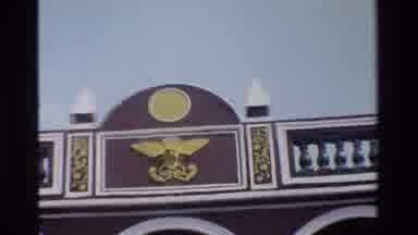 Hong Kong (1984): People Walking Near Red Building With Golden Symbol On Roof