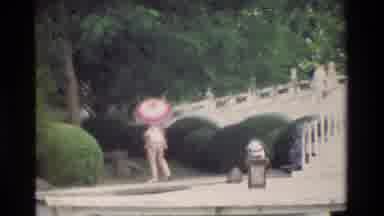 Hong Kong (1984): Touring Asian Lake Next To White Staircase Near Large White