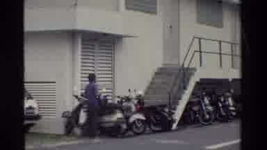 Thailand (1984): A Boy Standing With His Scooty And Some People Are At Office