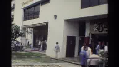 Thailand (1984): Group Of Guys Sitting And Talking At A Restaurant On A Shopping