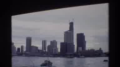 Thailand (1984): Film Of Heading Toward A Large City By Boat With Other Boats And