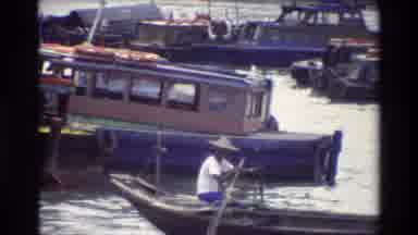 Thailand (1984): Tourists In A Boat And A Few Boats Close To A Beautiful Building