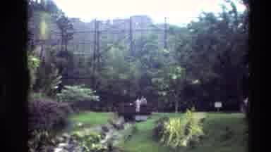 Thailand (1984): People Walk Along A Pathway Below A Staircase In A Park