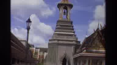 Thailand (1984): A Beautiful Belltower Surrounded By People In A City