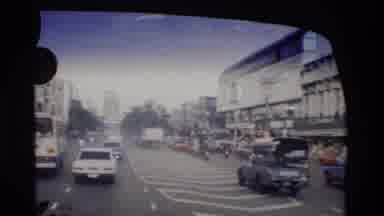 Thailand (1984): Footage Of People Riding In The Back Of A Bus While In Traffic