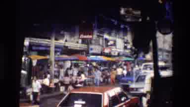 Thailand (1984): Busy Market Place With Cars And People And A Flag Flying
