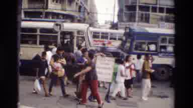 Thailand (1984): People In A City In Thailand Walking By A Bus Stop
