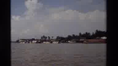 Thailand (1984): Houses In A Flood By A River And A Dog