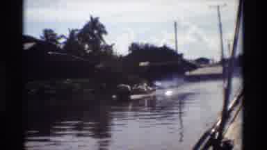Thailand (1984): Long Small Boats Speeding Down Canal With Murky Cloudy Water