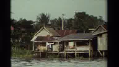 Thailand (1984): Older Buildings Along Side The Water In A Tropical Area