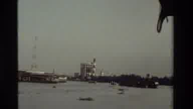 Thailand (1984): Small Wood Framed Houses With Colored Roofs Built Over A Lakeside