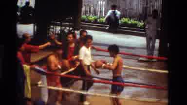 Thailand (1984): In Thailand Within A Boxing Ring Two Male Youths Fight In Shorts