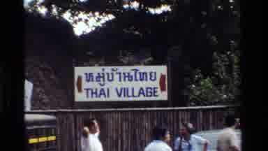 Thailand (1984): Vehicles And People Are Moving In The Village Of Thailand
