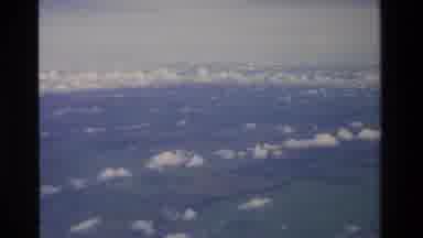 Thailand (1984): Airplane View Of Grass Fields On A Partly Cloudy Day