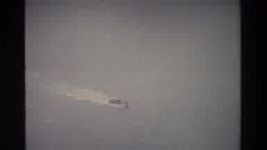 Thailand (1984): An Airplane Flying Over The Ocean And A Camera Zooming In On An