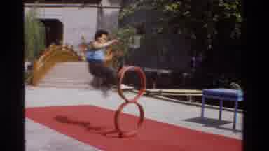 Thailand (1984): A Young Acrobat Practices Jumping Through Hoops