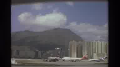 Thailand (1984): Scenic Airport Runway Showing Green Mountains With City Landscape