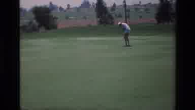 Laguna Hills California USA (1976): A Man And A Woman Play Golf In A Large Green