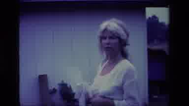 Aliso Viejo California USA (1977): Woman In White Dress Smiling And Laughing While