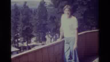 Big Bear California USA (1977): Person Stands On A Wooden Deck And Takes A Walk