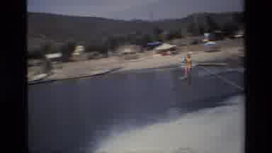 Canyon Lake California USA (1977): Person Riding On The Back Of The Boat Very