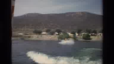 Canyon Lake California USA (1977): Person Rides On The Ocean Waves In A Yellow