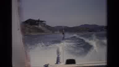 Canyon Lake California USA (1977): A Person Play In The Water Skating Faster